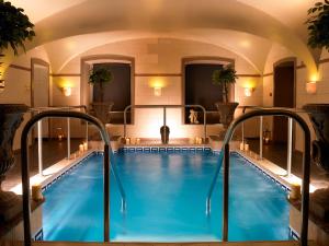 a pool in a hotel with an indoor swimming pool at Faithlegg Hotel in Waterford