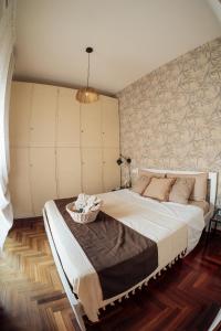 a bedroom with a large bed with a basket on it at Suite 51 Luxury home in Pescara