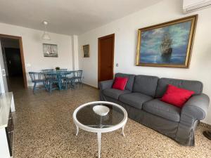 a living room with a couch and a table at Rincon de la Victoria - PMay in Rincón de la Victoria