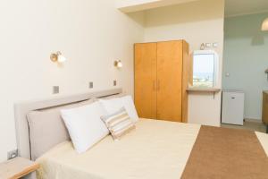 Postel nebo postele na pokoji v ubytování Vasileios Seaview Apartments