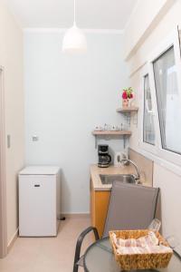 Kuchyň nebo kuchyňský kout v ubytování Vasileios Seaview Apartments + 7 fotografií