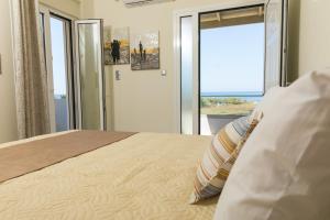 Postel nebo postele na pokoji v ubytování Vasileios Seaview Apartments