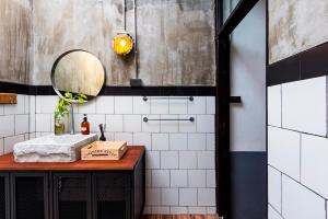 a bathroom with a sink and a mirror at Ombra House No. 21-24 in Chiang Mai +94 photos