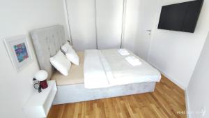 Postel nebo postele na pokoji v ubytování Apartments LORA in Bonila