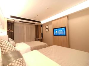 TV a/nebo společenská místnost v ubytování Morning Hotel, Liuyang Country Garden Municipal Government