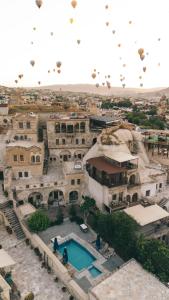 an aerial view of a building with a swimming pool at Tekkaya Cave Hotel in Goreme