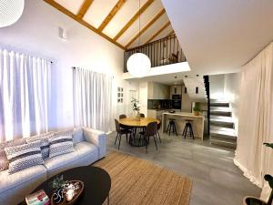 a living room with a couch and a table at House Roki in Vis