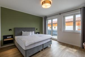 Postel nebo postele na pokoji v ubytování Hotel Baumann