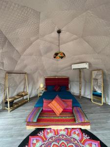 a room with a bed in a tent at Moon Muong Sang House 