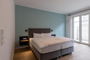 Postel nebo postele na pokoji v ubytování Hotel Baumann
