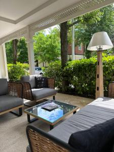 a patio with couches and a table with a lamp at Hotel Maestrale in Riccione