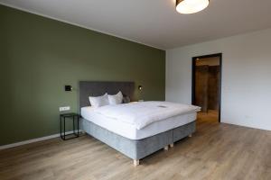 Postel nebo postele na pokoji v ubytování Hotel Baumann