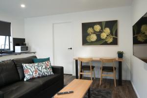 a living room with a couch and a table at Mt Field Retreat in National Park