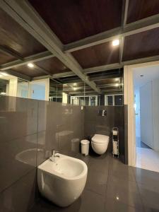 a bathroom with a sink and a toilet at Casa da Avenida VILLA INN in Braga