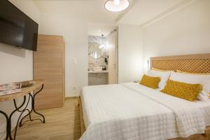 Postel nebo postele na pokoji v ubytování Casa Dimitrios Ammouliani