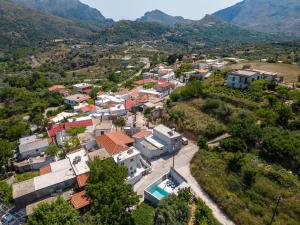 an aerial view of a small village in the mountains at Villa Venetia with Jacuzzi in Lambiní