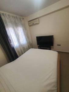 Televisyen dan/atau pusat hiburan di Korais apartment, Chania Crete +14 gambar