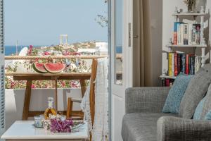 a living room with a view of the ocean at Venetian Suites III in Naxos Chora