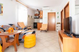 TV a/nebo společenská místnost v ubytování Apartment Mara