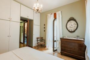 a bedroom with a bed and a dresser and a mirror at Casa Panoramica - by My Home In Como in Como
