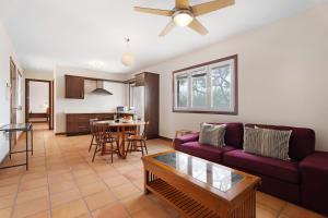 a living room with a couch and a table at La Calabacera Casa Verde con piscina, By Paramount Holidays in Guía de Isora