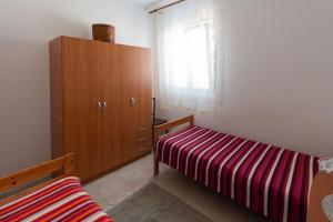 Postel nebo postele na pokoji v ubytování Apartment Mara