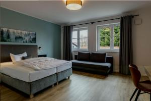 Postel nebo postele na pokoji v ubytování Hotel Baumann