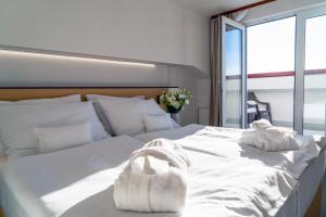 Ένα ή περισσότερα κρεβάτια σε δωμάτιο στο Wellness Hotel Frymburk
