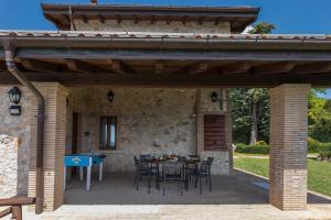A patio or other outdoor area at IL CASALE DEL NONNO 8&2 Emma Villas