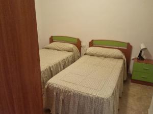 Giường trong phòng chung tại MARITIMO -ELMAR