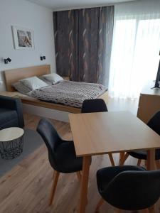 Postel nebo postele na pokoji v ubytování Apartmány VLK