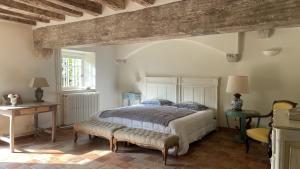 Ein Bett oder Betten in einem Zimmer der Unterkunft Guest House Le Clos Pasquier
