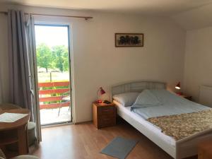Postel nebo postele na pokoji v ubytování Dom Jana
