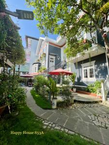 a house with a walkway in front of it at Căn Funny in Vung Tau