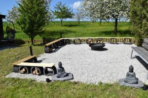 a park with a fire pit and a playground at Naturgeflüster Chalet in Morbach