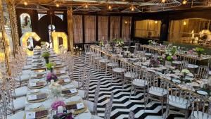 a banquet hall with white tables and chairs at Altinel Ankara Hotel & Convention Center in Ankara