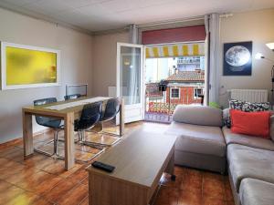 a living room with a couch and a table at E22164 Sant Ramon in Sant Feliu de Guíxols