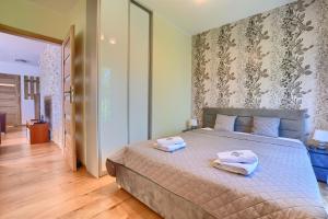 A bed or beds in a room at Hike & Ski Wisła