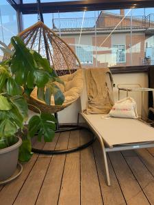 a porch with a hammock and a swing on a boat at Love Space Sensory Spa & relax suite in Santa Maria delle Mole