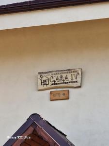a sign on the side of a building at CASA IV in Vama Veche