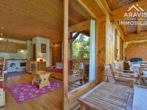 a log cabin with a kitchen and a living room at Appartement Le Grand-Bornand, 2 pièces, 4 personnes - FR-1-391-107 in Le Grand-Bornand