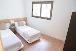Postel nebo postele na pokoji v ubytování Rambla de Mar Apartments