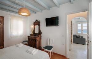 Postel nebo postele na pokoji v ubytování Riviera Naxian Home