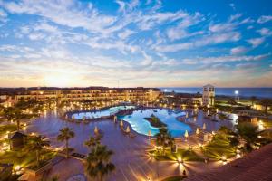 a view of a resort with a pool at night at Be Live Collection Saïdia in Saïdia