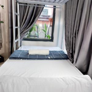 Tempat tidur dalam kamar di Hue nice dorm