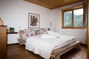 Postel nebo postele na pokoji v ubytování Fiesch-Lax Minnig Moritz