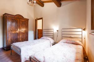 Postel nebo postele na pokoji v ubytování Borgo Cerbaiola