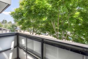 a view of a balcony with trees in the background at Brentwood 1br w gym rooftop nr shops bars LAX-1076 in Los Angeles