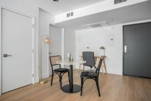 a dining room with a table and two chairs at Brentwood 1br w gym rooftop nr shops bars LAX-1076 in Los Angeles