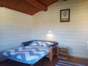 a bedroom with a bed in a room with a basketball picture at LUBBENES GÅRD in Molde